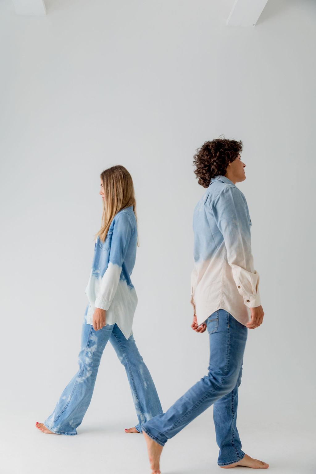 woman and man wearing upcycled bleached denim shirts and jeans